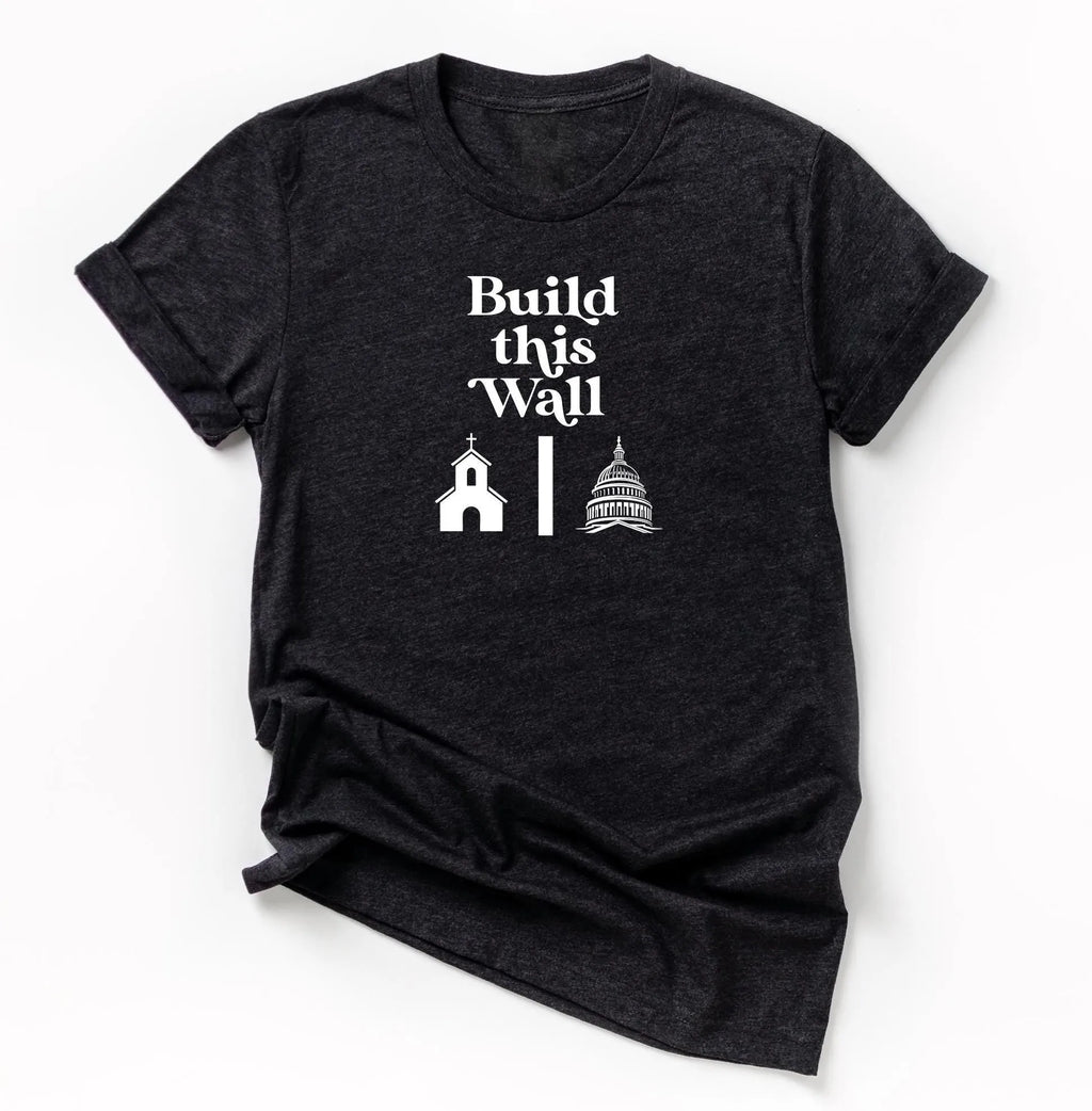 build this wall shirt.  black short sleeve shirt with white modern retro font and graphics of church being separated by wall and capital government building on other side.  snarky atheist shirt making fun of trump&#39;s wall plan.  anti-trump shirt.