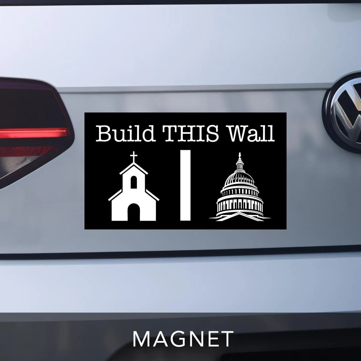 Build THIS Wall Car bumper magnet.  Black with white lettering and graphics.  Church graphic on left and government capitol building on right with a wall separating the two.